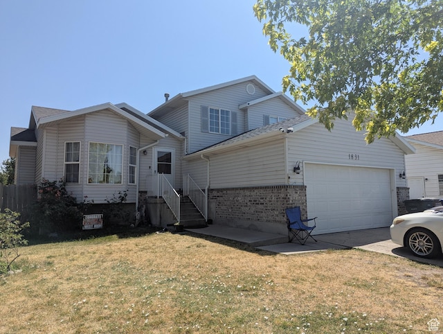 1831 W Dale Ridge Ave N, Salt Lake City, UT 84116 - view of front of house with an attached garage, concrete driveway, a front yard, and brick siding