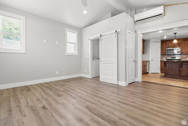 341 E 700 N, Spanish Fork, UT 84660 - unfurnished living room with a wall mounted air conditioner, a barn door, a ceiling fan, light wood-style floors, and recessed lighting