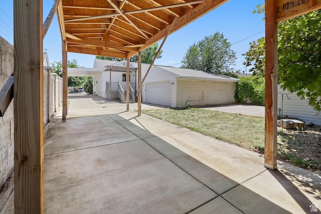 341 E 700 N, Spanish Fork, UT 84660 - view of patio / terrace featuring an outbuilding and a garage