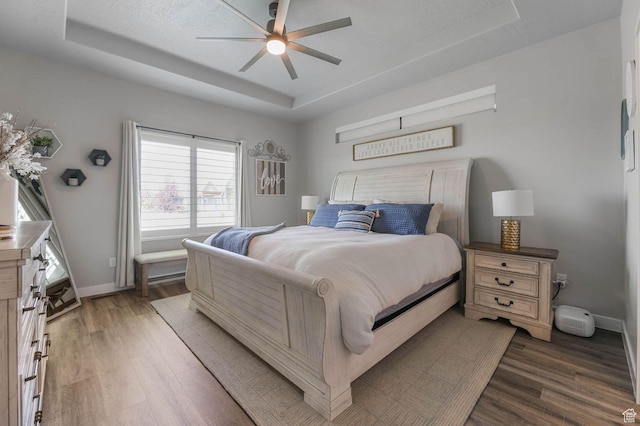 5671 S 650 E, Washington Terrace, UT 84405 - bedroom featuring a tray ceiling, wood finished floors, and ceiling fan