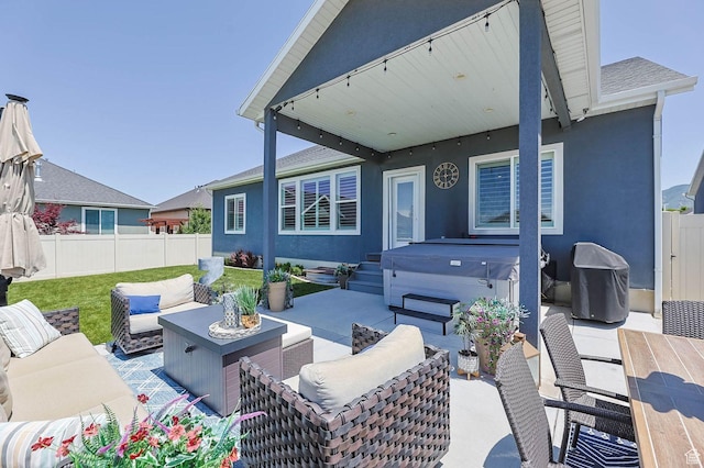 5671 S 650 E, Washington Terrace, UT 84405 - fenced backyard featuring a hot tub, outdoor lounge area, a patio, and grilling area