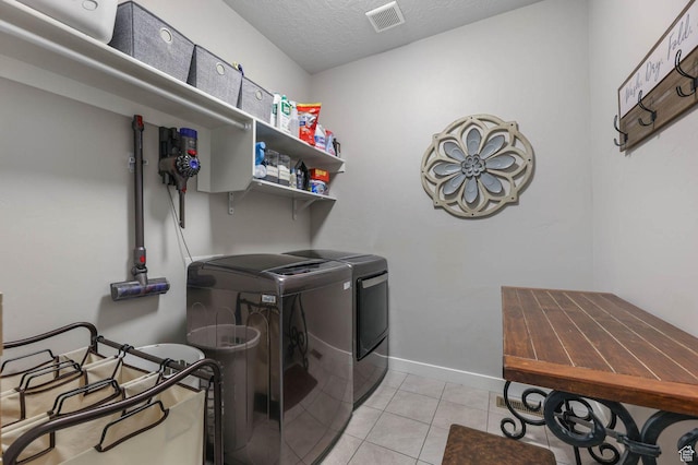 5671 S 650 E, Washington Terrace, UT 84405 - laundry area with separate washer and dryer, a textured ceiling, and light tile patterned floors