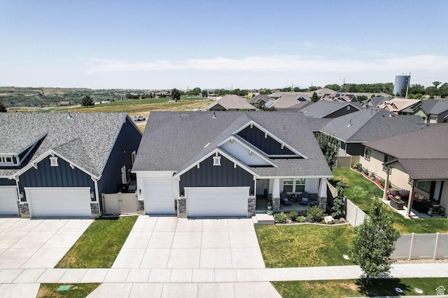 5671 S 650 E, Washington Terrace, UT 84405 - view of front of house with board and batten siding, a garage, stone siding, concrete driveway, and a shingled roof