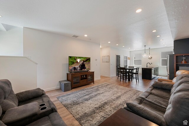 507 W 620 N Unit 127, Centerville, UT 84014 - living area featuring light wood-style flooring and recessed lighting