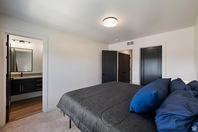 507 W 620 N Unit 127, Centerville, UT 84014 - bedroom with light carpet and connected bathroom