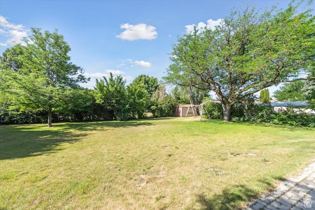 666 E Shelly Ave N, American Fork, UT 84003 - view of grassy yard featuring a shed