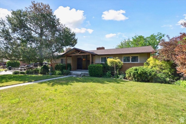 666 E Shelly Ave N, American Fork, UT 84003 - ranch-style home with a front lawn and a chimney