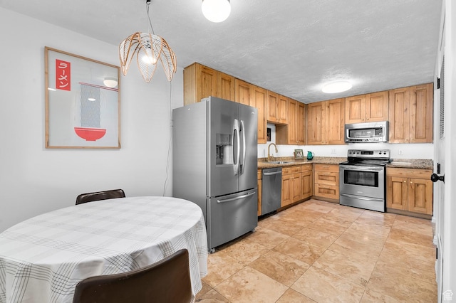 314 W Center St Unit 123, Bountiful, UT 84010 - kitchen featuring stainless steel appliances, light stone counters, and a textured ceiling