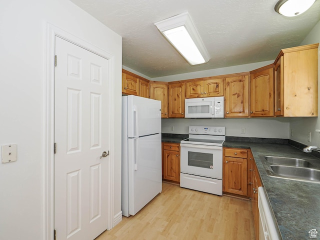 478 W 470 S, Provo, UT 84601 - kitchen with white appliances, brown cabinetry, and dark countertops