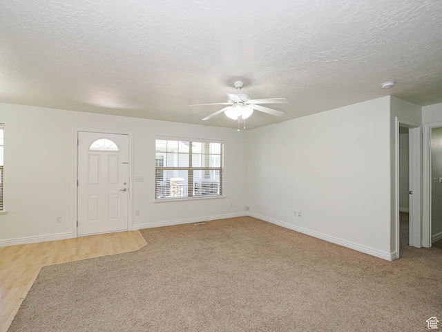 478 W 470 S, Provo, UT 84601 - entrance foyer with ceiling fan, a textured ceiling, and light carpet