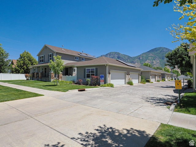 478 W 470 S, Provo, UT 84601 - view of front facade featuring roof mounted solar panels, a mountain view, and concrete driveway