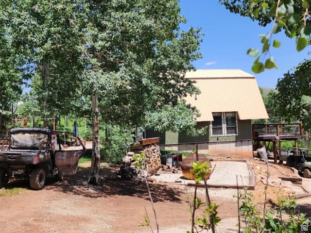 11829 Falcon Pt Unit H21, Huntsville, UT 84317 - view of front of home featuring a metal roof and a wooden deck