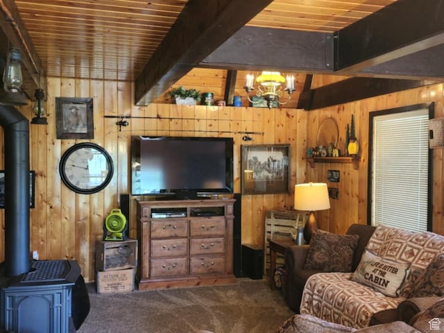 11829 Falcon Pt Unit H21, Huntsville, UT 84317 - living room featuring wooden walls, a wood stove, carpet floors, a chandelier, and a wooden ceiling with exposed beams