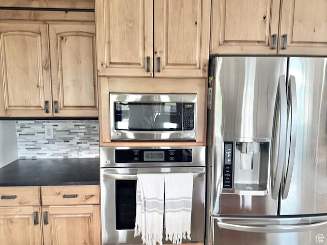 1790 S 940 W, Richfield, UT 84701 - kitchen with appliances with stainless steel finishes, light brown cabinets, decorative backsplash, and dark countertops
