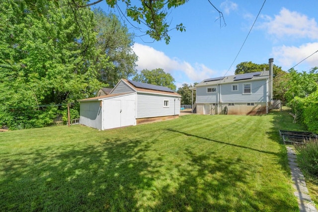 1243 Oak St, Ogden, UT 84401 - view of green lawn featuring a shed