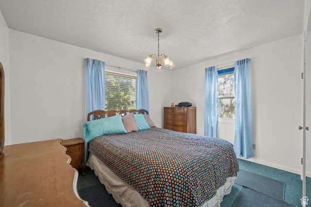 1243 Oak St, Ogden, UT 84401 - carpeted bedroom featuring a chandelier and arched walkways