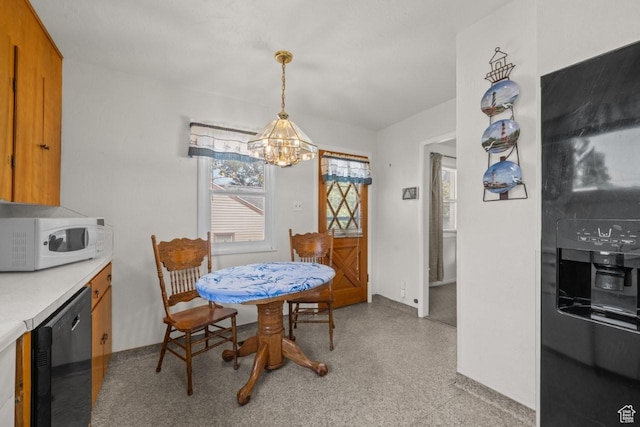 1243 Oak St, Ogden, UT 84401 - dining area with a chandelier and baseboards