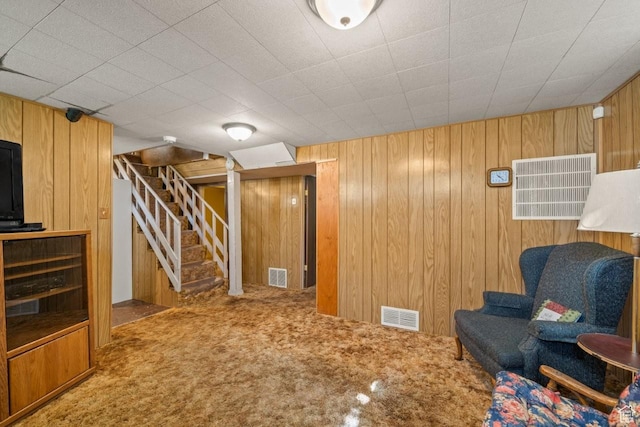 1243 Oak St, Ogden, UT 84401 - sitting room featuring carpet, stairs, and wooden walls