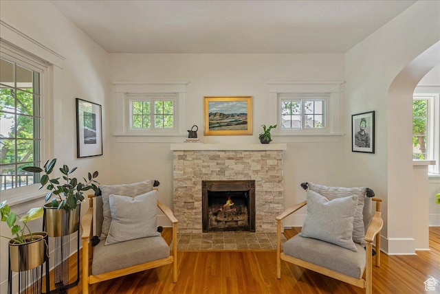 1351 E Browning Ave S, Salt Lake City, UT 84105 - living area featuring arched walkways, wood finished floors, and plenty of natural light