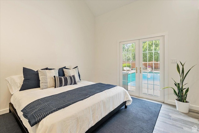 1351 E Browning Ave S, Salt Lake City, UT 84105 - bedroom with french doors, access to outside, vaulted ceiling, and wood finished floors