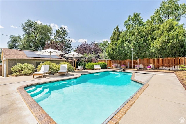 1351 E Browning Ave S, Salt Lake City, UT 84105 - view of swimming pool with a patio area, a fenced backyard, and a diving board