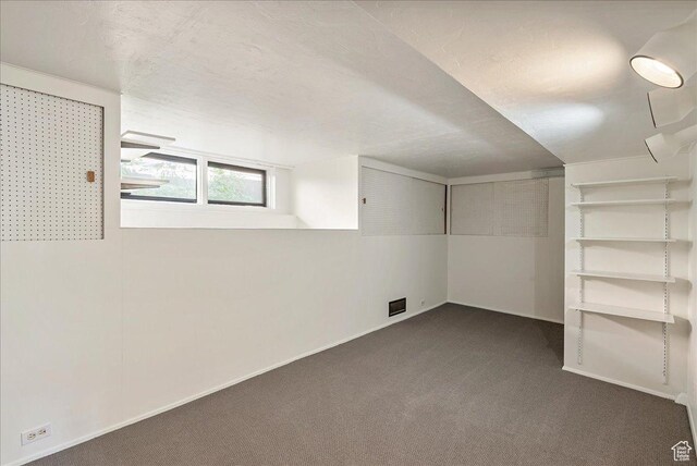 1351 E Browning Ave S, Salt Lake City, UT 84105 - below grade area with dark carpet and baseboards
