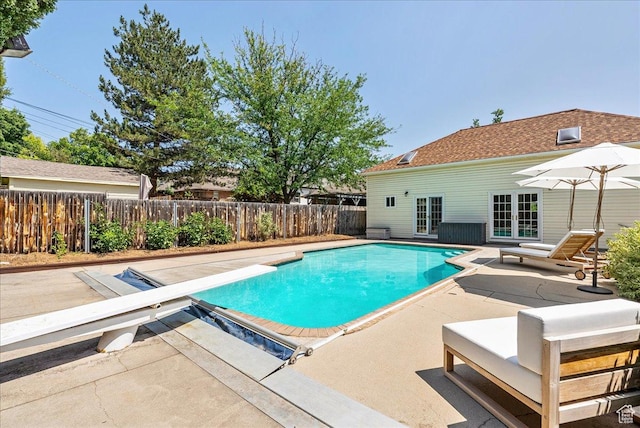 1351 E Browning Ave S, Salt Lake City, UT 84105 - view of swimming pool with a patio, a diving board, french doors, and a fenced backyard