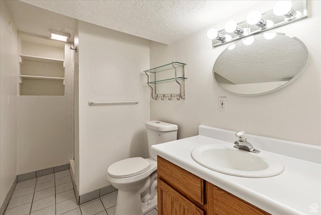 1351 E Browning Ave S, Salt Lake City, UT 84105 - bathroom with a textured ceiling, vanity, and tile patterned floors