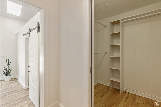 1351 E Browning Ave S, Salt Lake City, UT 84105 - walk in closet with light wood-type flooring and a barn door