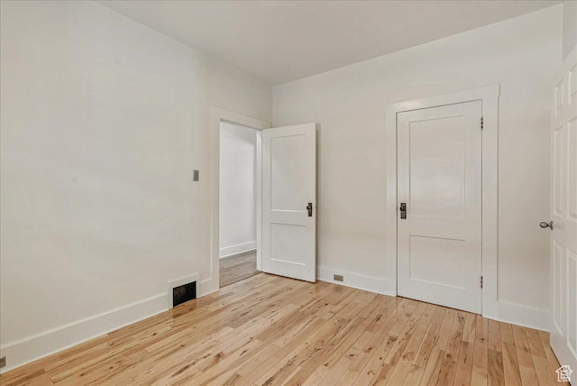 1351 E Browning Ave S, Salt Lake City, UT 84105 - spare room featuring light wood-style floors and baseboards