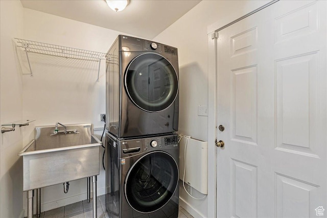 1351 E Browning Ave S, Salt Lake City, UT 84105 - laundry room featuring stacked washer / drying machine and baseboards
