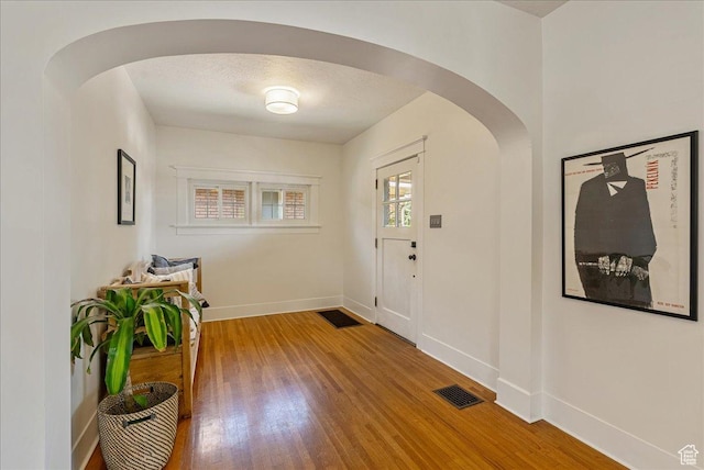 1351 E Browning Ave S, Salt Lake City, UT 84105 - foyer with arched walkways and wood finished floors