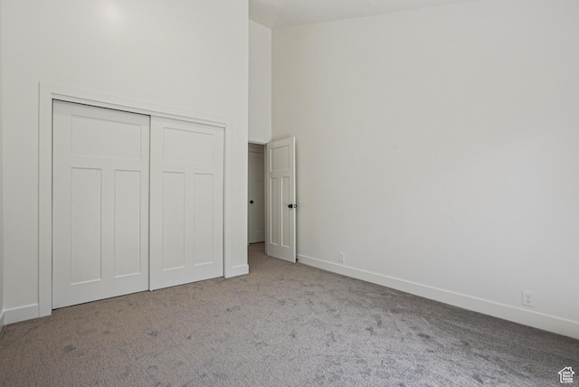 2174 Fenchurch Dr, Park City, UT 84060 - unfurnished bedroom with carpet, a closet, and a towering ceiling