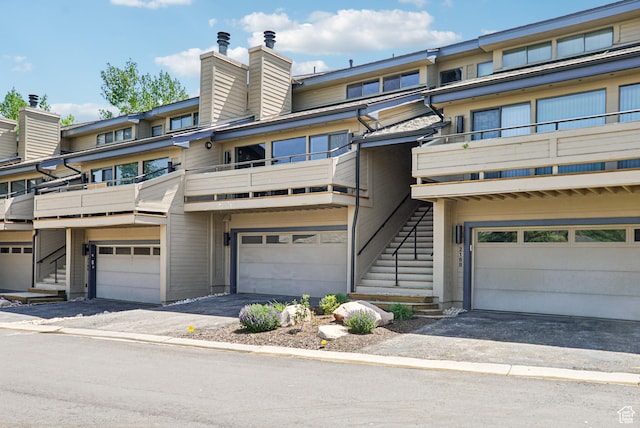 2174 Fenchurch Dr, Park City, UT 84060 - view of front of home featuring stairs, a balcony, and an attached garage