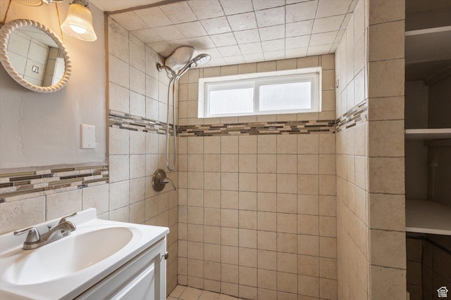 754 E 500 S, Provo, UT 84606 - bathroom with a tile shower, tile walls, and vanity