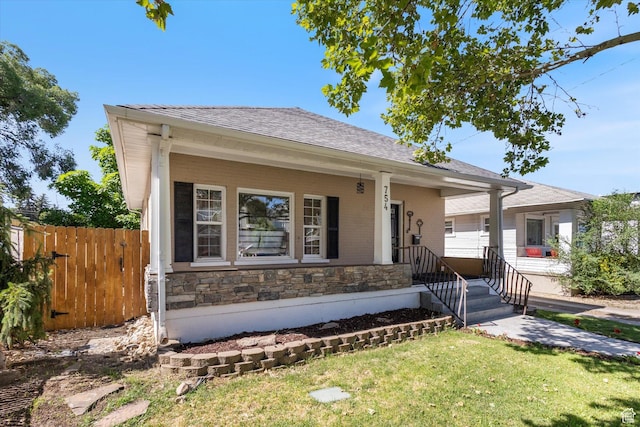 754 E 500 S, Provo, UT 84606 - view of front of home featuring a shingled roof, a porch, and stone siding