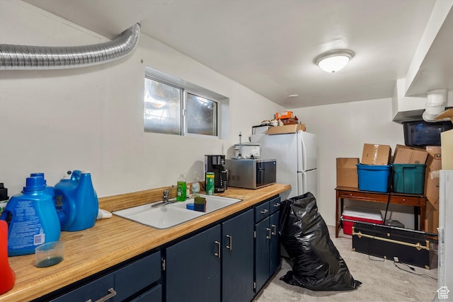8168 S Darin St, Midvale, UT 84047 - kitchen featuring stainless steel microwave and blue cabinetry