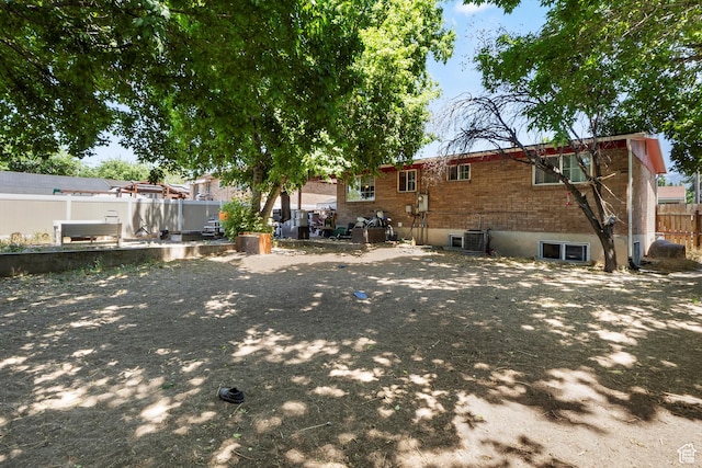 8168 S Darin St, Midvale, UT 84047 - rear view of house with brick siding