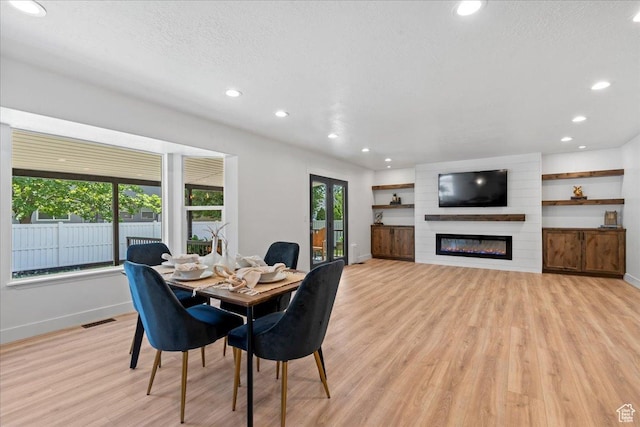692 E Country Breeze Cir S, Draper, UT 84020 - dining room with light wood-type flooring, recessed lighting, and a large fireplace