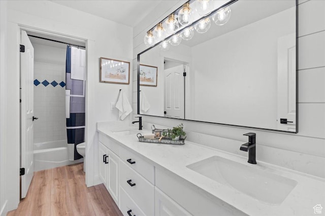692 E Country Breeze Cir S, Draper, UT 84020 - bathroom with double vanity, shower / bath combo with shower curtain, and wood finished floors