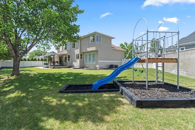 692 E Country Breeze Cir S, Draper, UT 84020 - back of property featuring a playground, stucco siding, and a patio