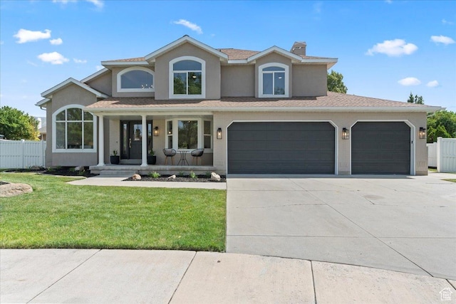 692 E Country Breeze Cir S, Draper, UT 84020 - view of front of property with concrete driveway, covered porch, a chimney, and stucco siding