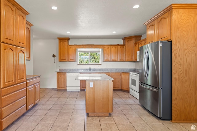 890 E Monroe Canyon Rd S, Monroe, UT 84754 - kitchen with white appliances, a kitchen island, light tile patterned floors, recessed lighting, and brown cabinets