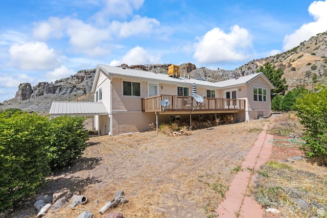 890 E Monroe Canyon Rd S, Monroe, UT 84754 - rear view of property with a deck with mountain view and a metal roof