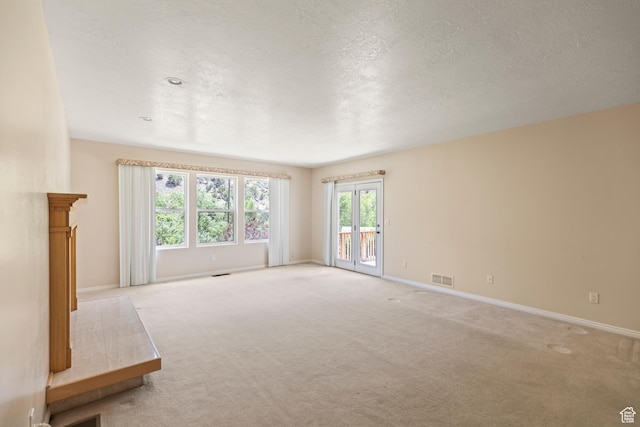 890 E Monroe Canyon Rd S, Monroe, UT 84754 - unfurnished living room with light colored carpet and a textured ceiling