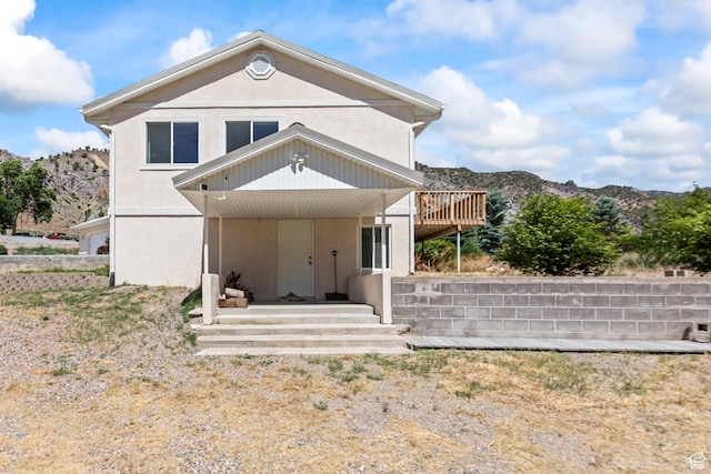 890 E Monroe Canyon Rd S, Monroe, UT 84754 - view of front of home with stucco siding and a deck with mountain view