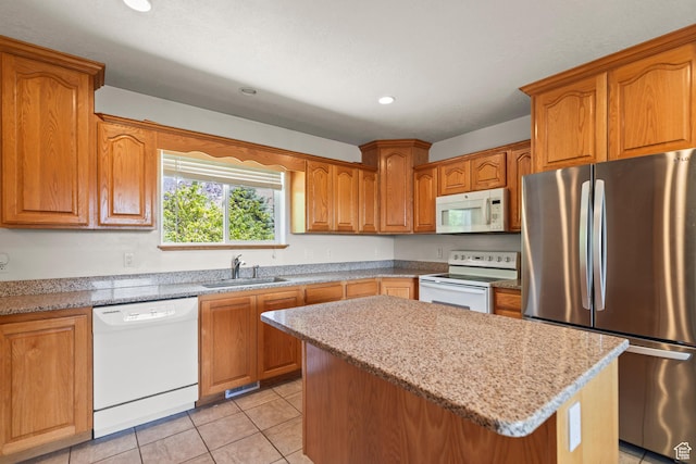 890 E Monroe Canyon Rd S, Monroe, UT 84754 - kitchen featuring white appliances, a kitchen island, brown cabinetry, recessed lighting, and light tile patterned floors