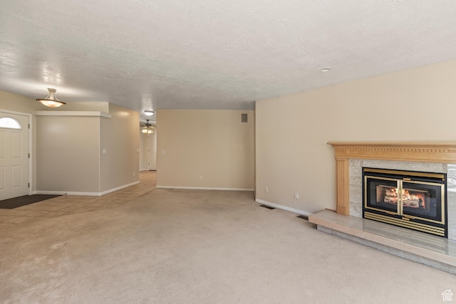 890 E Monroe Canyon Rd S, Monroe, UT 84754 - unfurnished living room with light carpet, a premium fireplace, and a textured ceiling