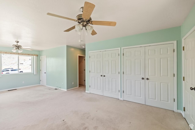 890 E Monroe Canyon Rd S, Monroe, UT 84754 - unfurnished bedroom featuring carpet floors, multiple closets, and a ceiling fan