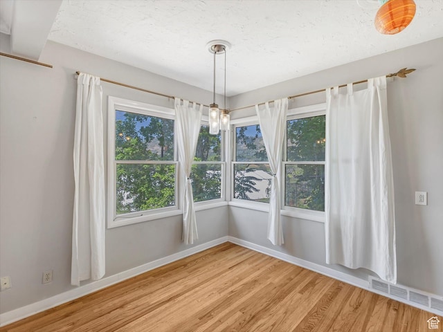 1815 E Hillcrest Ave, Salt Lake City, UT 84106 - unfurnished dining area featuring wood finished floors and baseboards
